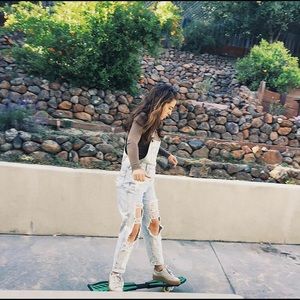 Ripped denim overalls